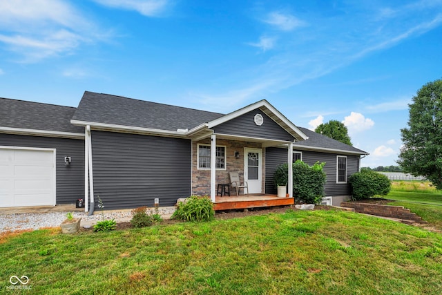 8638 W Flatwoods Rd, Gosport, IN 47433 - ranch-style home featuring covered porch, a front yard, an attached garage, and a shingled roof