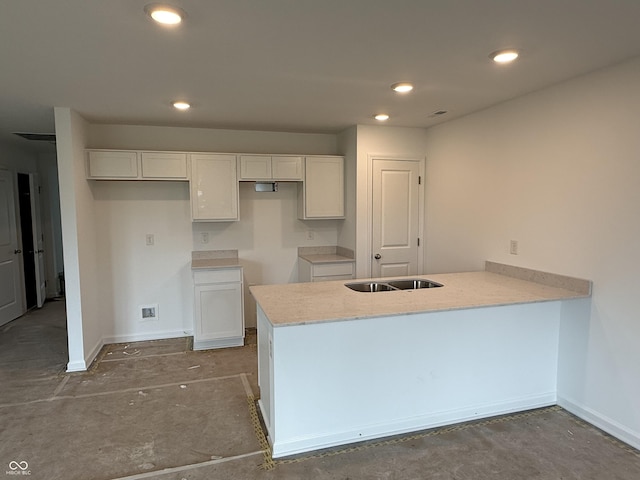 1436 Aster Dr, Shelbyville, IN 46176 - kitchen featuring a peninsula, white cabinets, recessed lighting, and light stone counters