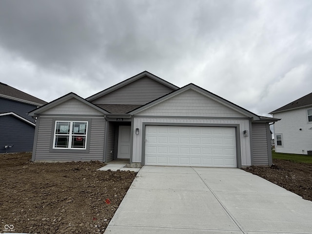 1436 Aster Dr, Shelbyville, IN 46176 - ranch-style home with concrete driveway and an attached garage