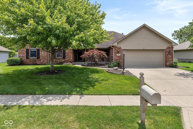 767 Harvest Ridge Dr, Avon, IN 46123 - view of front of home featuring an attached garage, brick siding, driveway, and a front yard