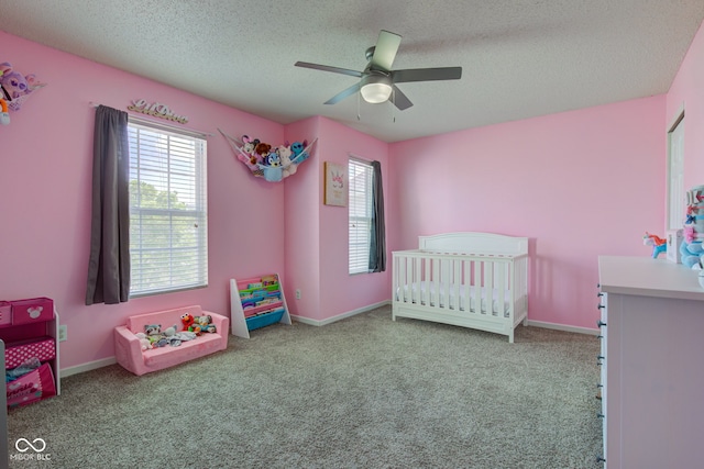 9593 W Constellation Dr, Pendleton, IN 46064 - bedroom featuring multiple windows, a textured ceiling, carpet, and a crib