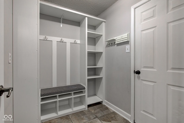 9593 W Constellation Dr, Pendleton, IN 46064 - mudroom with a textured ceiling