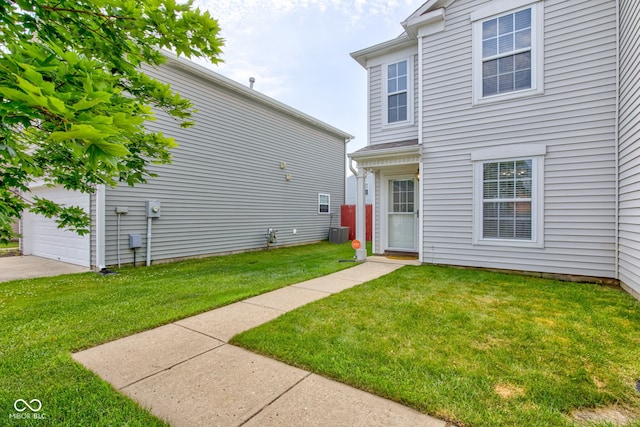 9593 W Constellation Dr, Pendleton, IN 46064 - back of property with a yard, a garage, and concrete driveway