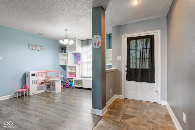 9593 W Constellation Dr, Pendleton, IN 46064 - foyer with a chandelier and a textured ceiling