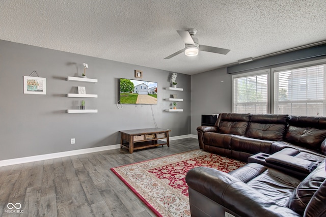 9593 W Constellation Dr, Pendleton, IN 46064 - living room featuring wood finished floors, a ceiling fan, and a textured ceiling