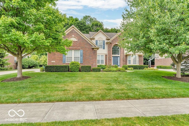 5865 Osage Dr, Carmel, IN 46033 - traditional home featuring brick siding and a front lawn