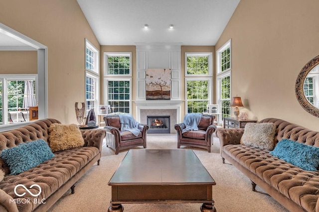 5865 Osage Dr, Carmel, IN 46033 - carpeted living room featuring vaulted ceiling and a fireplace