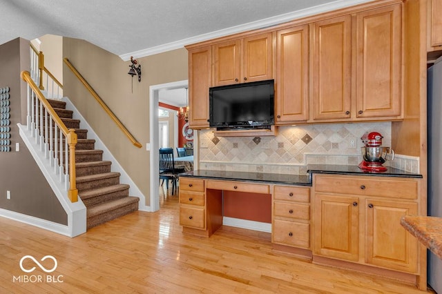 5865 Osage Dr, Carmel, IN 46033 - kitchen with tasteful backsplash, light wood-style flooring, and a textured ceiling