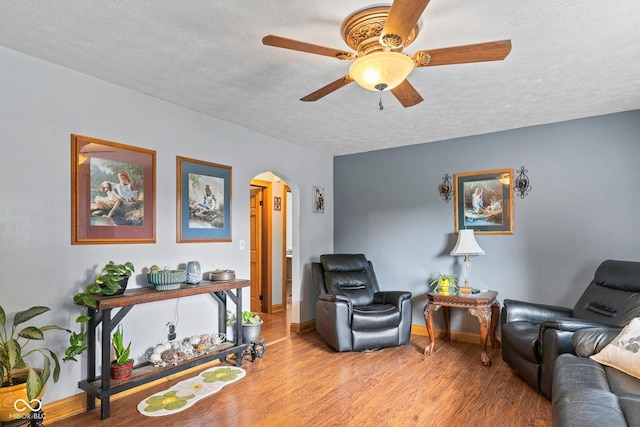 5110 W County Road 400 N, Scipio, IN 47273 - living room with arched walkways, a ceiling fan, a textured ceiling, and wood finished floors