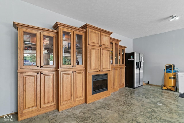 5110 W County Road 400 N, Scipio, IN 47273 - kitchen with fridge with ice dispenser, brown cabinets, a textured ceiling, glass insert cabinets, and carpet