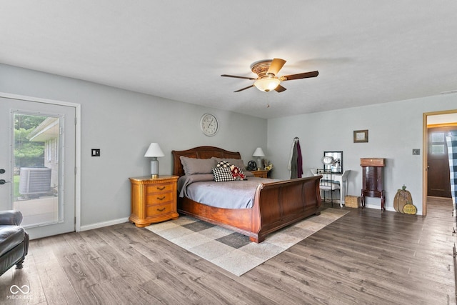 5110 W County Road 400 N, Scipio, IN 47273 - bedroom with access to exterior, wood finished floors, and a ceiling fan
