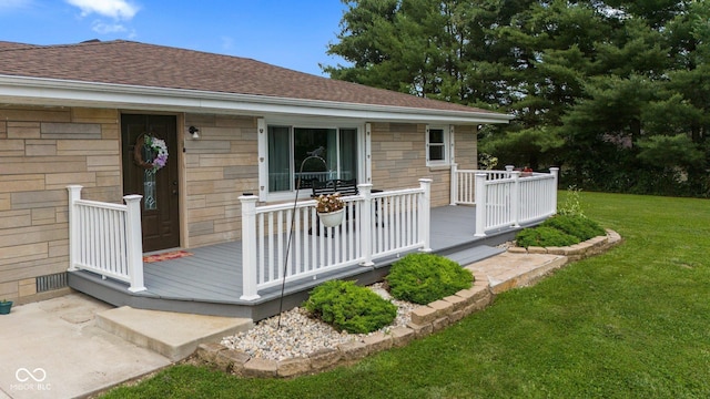 5110 W County Road 400 N, Scipio, IN 47273 - view of exterior entry featuring a shingled roof, a yard, a deck, and stone siding