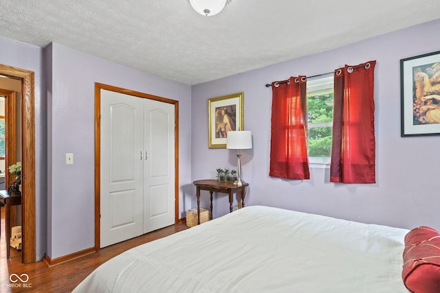 5110 W County Road 400 N, Scipio, IN 47273 - bedroom with wood finished floors, a closet, and a textured ceiling