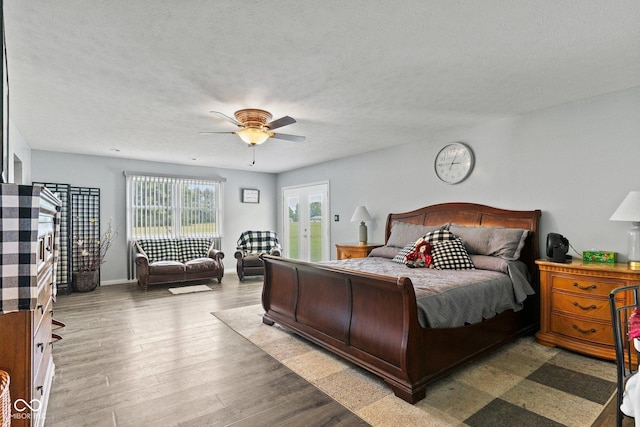 5110 W County Road 400 N, Scipio, IN 47273 - bedroom featuring access to outside, wood finished floors, a ceiling fan, and a textured ceiling