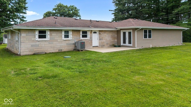 5110 W County Road 400 N, Scipio, IN 47273 - back of property with french doors, a patio, a lawn, a shingled roof, and stone siding