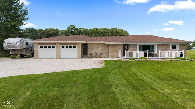 5110 W County Road 400 N, Scipio, IN 47273 - ranch-style house featuring stone siding, driveway, a porch, an attached garage, and a front lawn