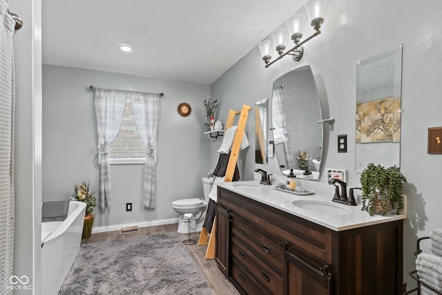 5110 W County Road 400 N, Scipio, IN 47273 - full bathroom featuring double vanity, a freestanding tub, and wood finished floors