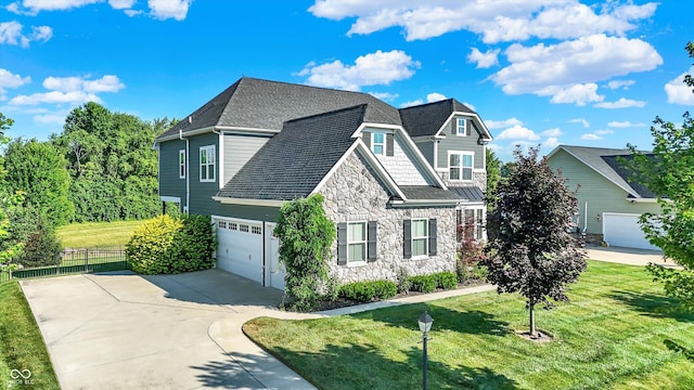 16711 Meadow Wood Dr, Noblesville, IN 46062 - view of front facade with stone siding, concrete driveway, and an attached garage