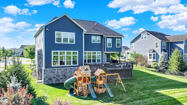 16711 Meadow Wood Dr, Noblesville, IN 46062 - rear view of property featuring stone siding, a playground, and a wooden deck