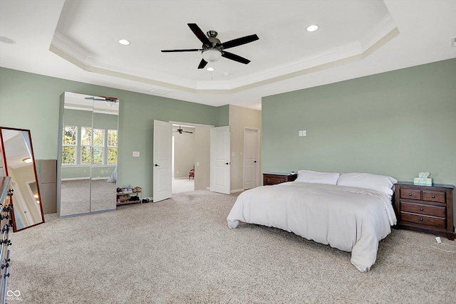 16711 Meadow Wood Dr, Noblesville, IN 46062 - bedroom featuring a tray ceiling, crown molding, carpet flooring, recessed lighting, and ceiling fan