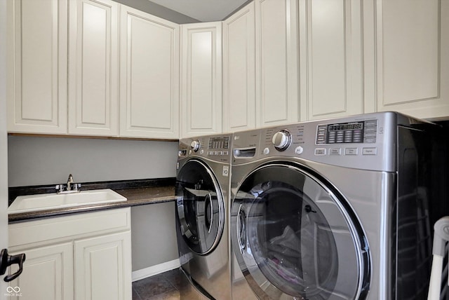 16711 Meadow Wood Dr, Noblesville, IN 46062 - laundry area featuring washing machine and clothes dryer and cabinet space