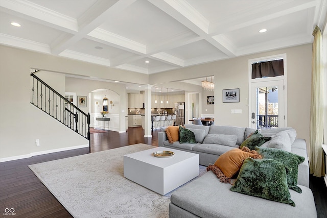 16711 Meadow Wood Dr, Noblesville, IN 46062 - living area with arched walkways, stairway, dark wood-type flooring, coffered ceiling, and beamed ceiling