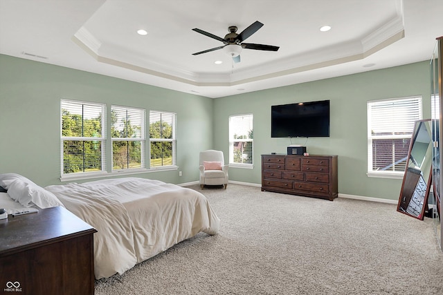 16711 Meadow Wood Dr, Noblesville, IN 46062 - carpeted bedroom with a tray ceiling, ornamental molding, recessed lighting, multiple windows, and ceiling fan