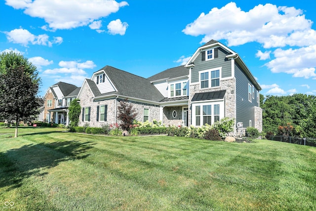 16711 Meadow Wood Dr, Noblesville, IN 46062 - view of front of house with stone siding and a standing seam roof
