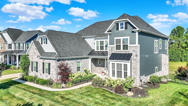 16711 Meadow Wood Dr, Noblesville, IN 46062 - view of front of home featuring stone siding, a standing seam roof, and a metal roof