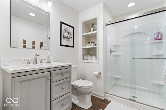 5542 Pennycress Dr, Noblesville, IN 46062 - full bathroom with a stall shower, vanity, wood finished floors, and built in features