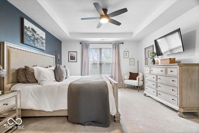5542 Pennycress Dr, Noblesville, IN 46062 - bedroom featuring a raised ceiling, light carpet, and ceiling fan