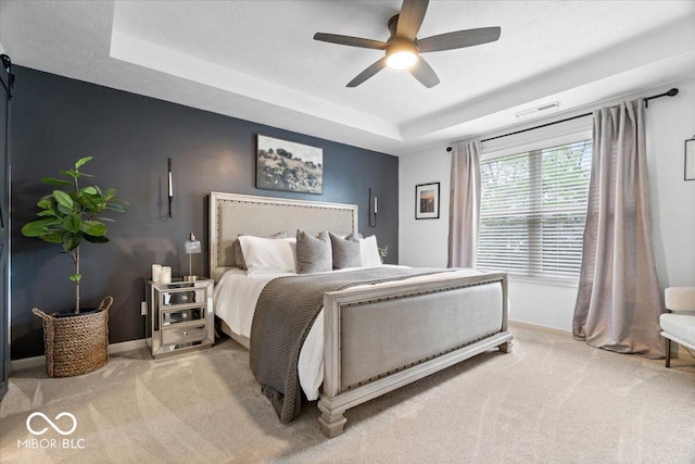 5542 Pennycress Dr, Noblesville, IN 46062 - carpeted bedroom featuring a tray ceiling and ceiling fan