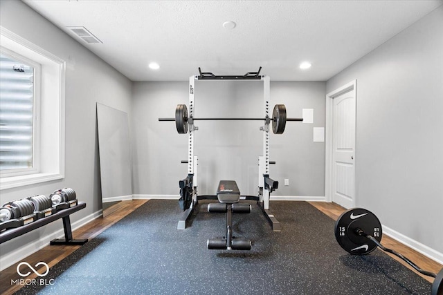 5542 Pennycress Dr, Noblesville, IN 46062 - workout area with recessed lighting and wood finished floors