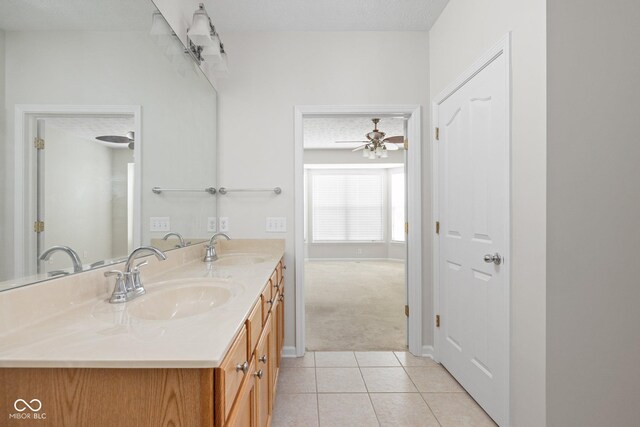 13019 Pinner Ave, Fishers, IN 46037 - full bath with double vanity, tile patterned floors, and a ceiling fan