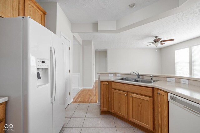 13019 Pinner Ave, Fishers, IN 46037 - kitchen with white appliances, a textured ceiling, ceiling fan, light countertops, and light tile patterned floors