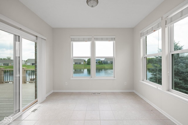 13019 Pinner Ave, Fishers, IN 46037 - spare room featuring a water view and light tile patterned floors