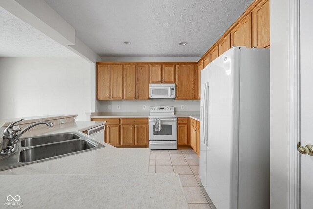 13019 Pinner Ave, Fishers, IN 46037 - kitchen featuring white appliances, light tile patterned floors, a textured ceiling, light countertops, and recessed lighting