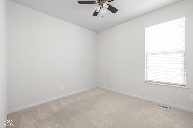 13019 Pinner Ave, Fishers, IN 46037 - unfurnished room featuring carpet flooring, ceiling fan, and healthy amount of natural light