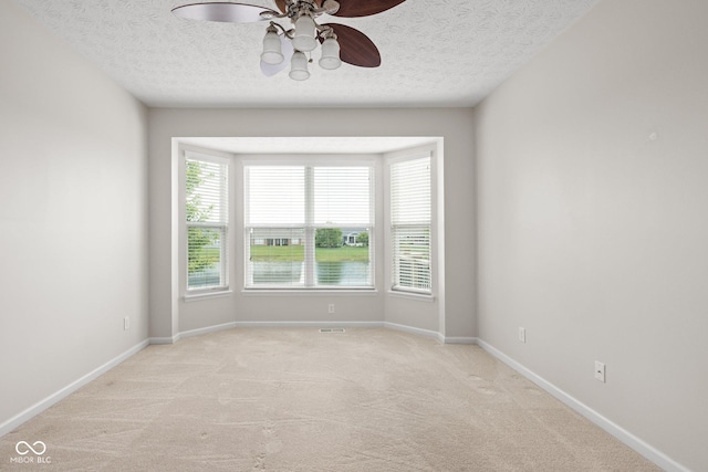 13019 Pinner Ave, Fishers, IN 46037 - unfurnished room featuring a ceiling fan, light carpet, and a textured ceiling