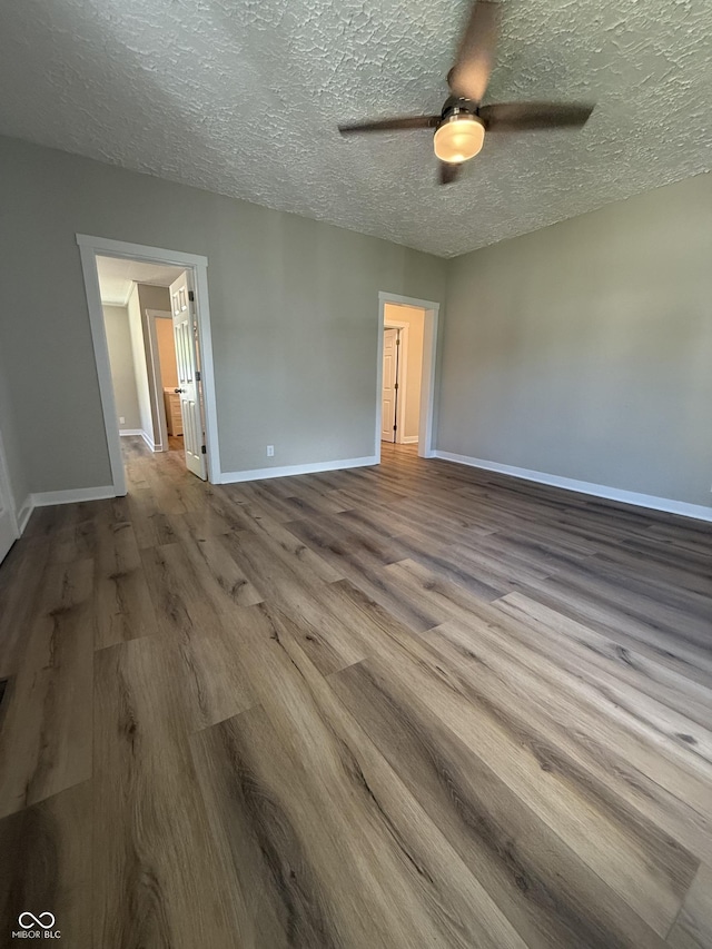 131 S Beatty St, Columbus, IN 47201 - spare room with wood finished floors, ceiling fan, and a textured ceiling
