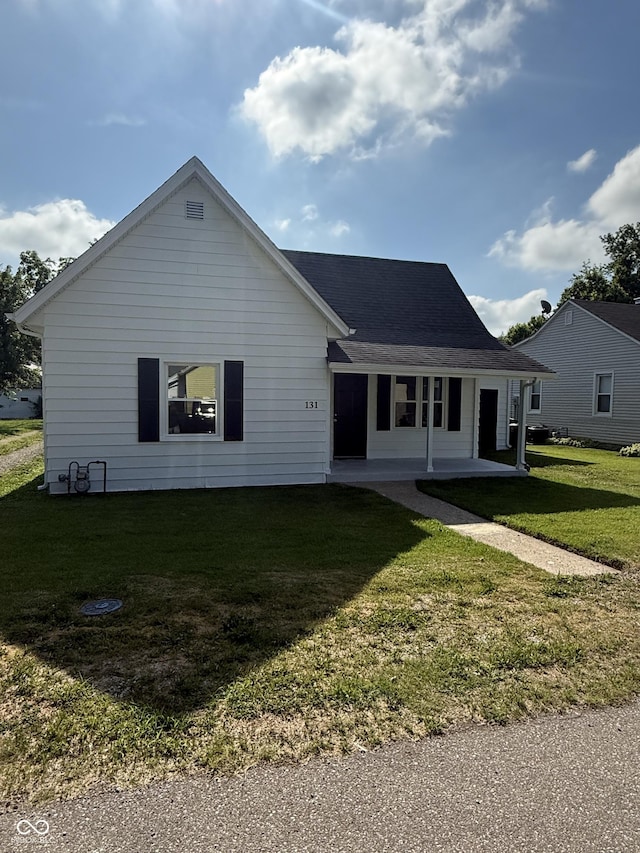 131 S Beatty St, Columbus, IN 47201 - ranch-style home featuring a front yard and a porch