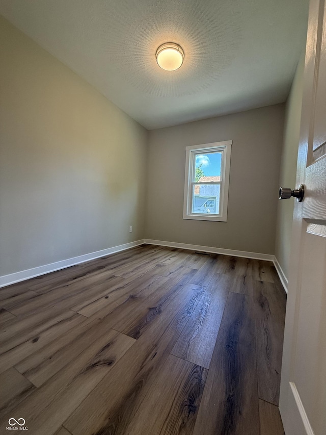 131 S Beatty St, Columbus, IN 47201 - unfurnished room with dark wood-style flooring and baseboards