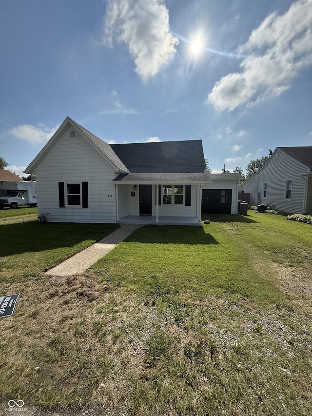 131 S Beatty St, Columbus, IN 47201 - ranch-style home featuring a front yard and roof with shingles