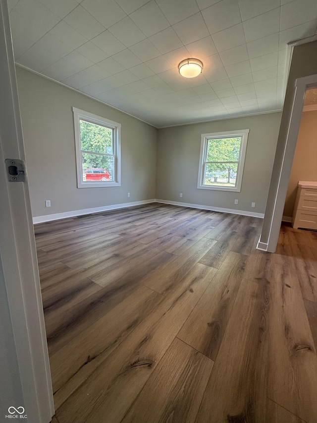 131 S Beatty St, Columbus, IN 47201 - spare room with plenty of natural light and wood finished floors