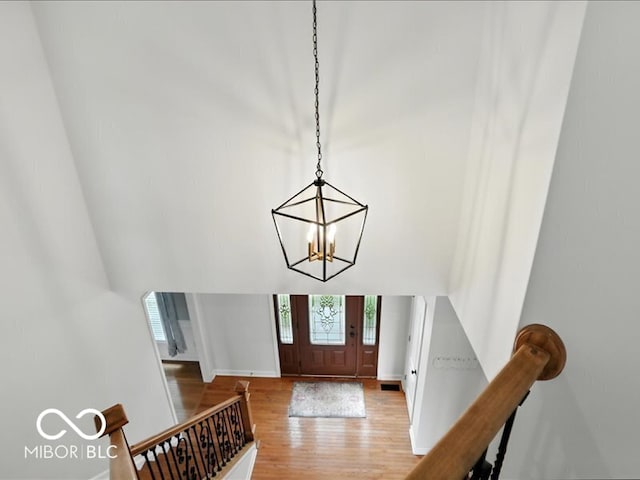 4233 Dartmoor Dr, Greenwood, IN 46143 - foyer entrance featuring light wood-style floors and a chandelier