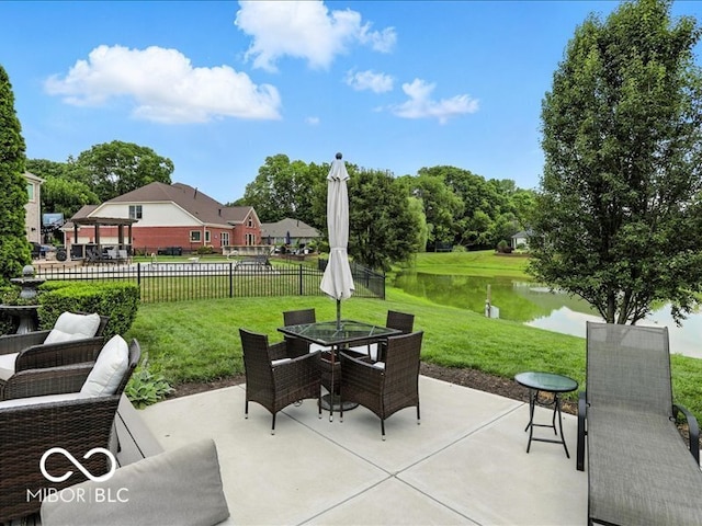 4233 Dartmoor Dr, Greenwood, IN 46143 - view of patio featuring outdoor dining space and a water view
