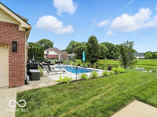 4233 Dartmoor Dr, Greenwood, IN 46143 - swimming pool featuring a yard, a patio, and a water view