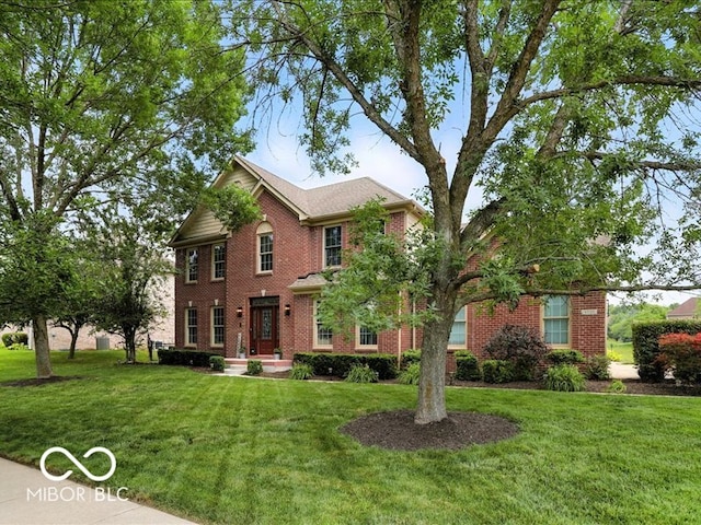 4233 Dartmoor Dr, Greenwood, IN 46143 - view of front of house with a front lawn and brick siding