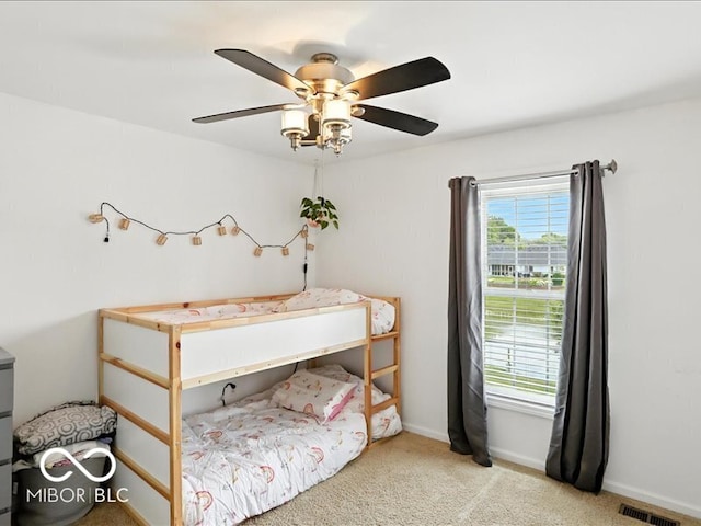 4233 Dartmoor Dr, Greenwood, IN 46143 - carpeted bedroom featuring ceiling fan and baseboards