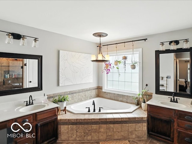 4233 Dartmoor Dr, Greenwood, IN 46143 - bathroom with a garden tub and two vanities